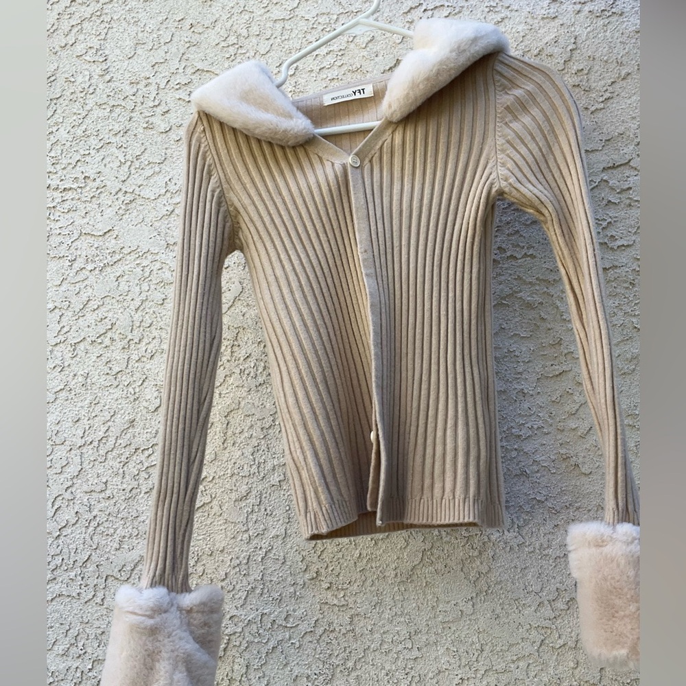 Fitter beige button down sweater with white fuzzy sleeves and collar